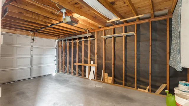 a view of an empty room with wooden walls