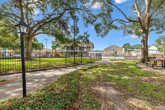 a view of a swimming pool with a patio