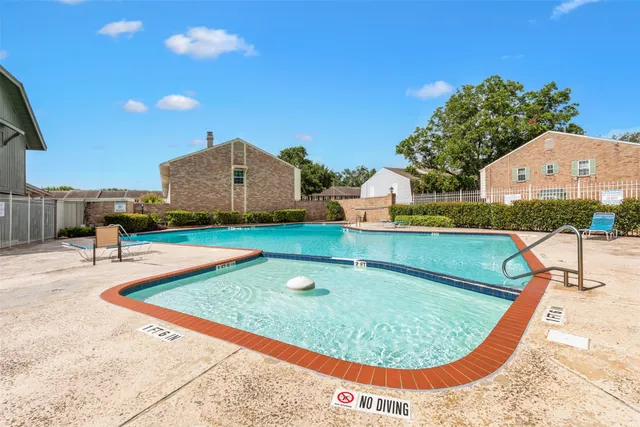 a front view of house with yard and outdoor seating