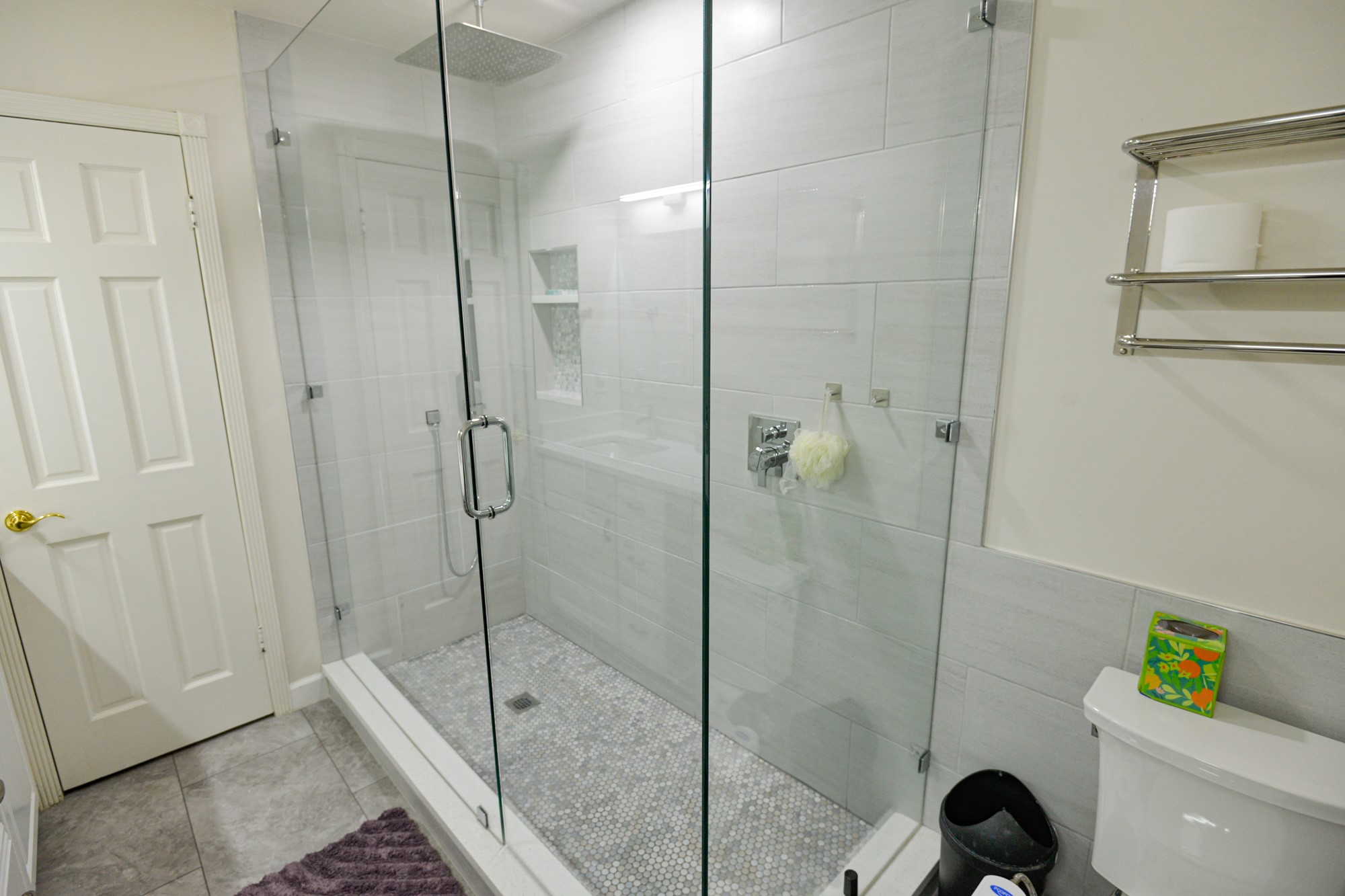 10710 D-K Ranch Road Austin, TX 78759 - Photo 26 of 34 A well-appointed shower space, featuring sleek tile work and a convenient built-in niche for toiletries.