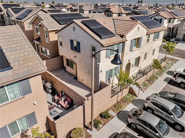 an aerial view of a residential houses with outdoor space