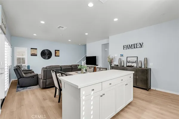 a kitchen with kitchen island a white counter top space