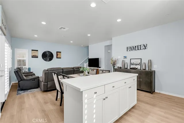 a kitchen with kitchen island a white counter top space