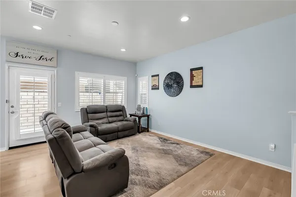 a living room with furniture and a window