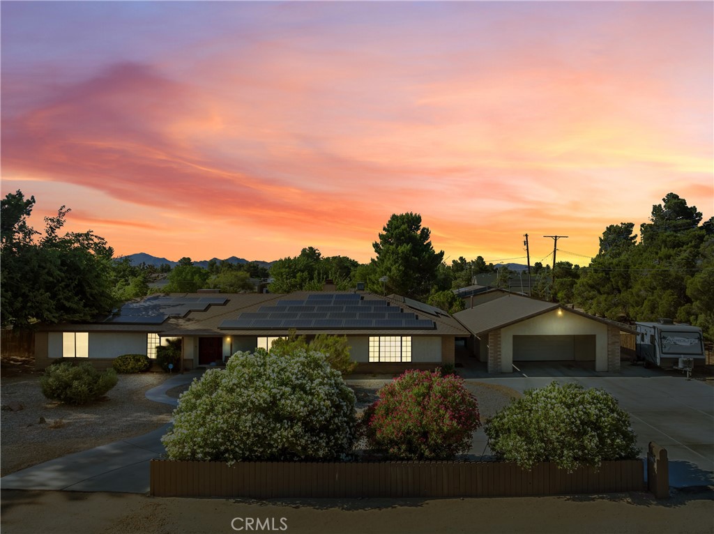20770 Ottawa Road Apple Valley, CA 92308 - Photo 1 of 1 a front view of a house with a yard