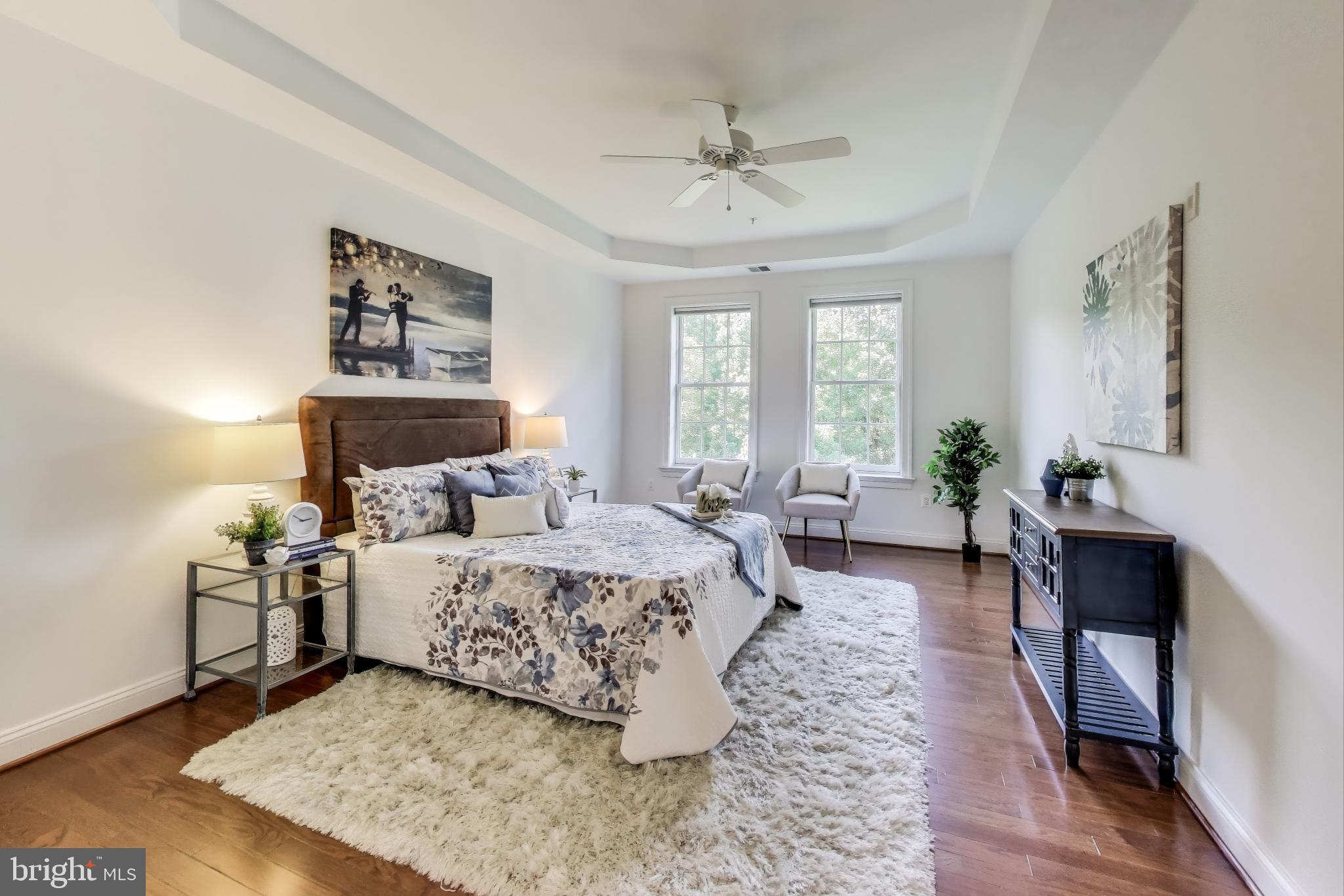 1781 Chain Bridge Road, Unit 402 McLean, VA 22102 - Photo 27 of 53 Tray ceiling & ceiling fan in primary bedroom