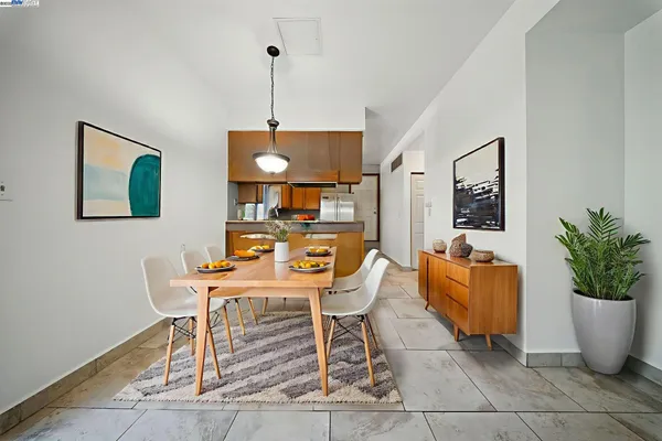 a dining room with furniture and window
