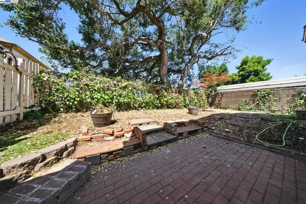 a view of a yard with an outdoor seating
