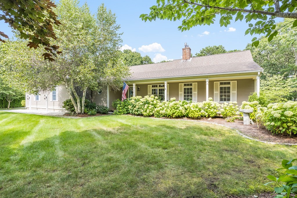 20 Courtney Road Harwich, MA 02645 - Photo 1 of 42 a front view of a house with garden
