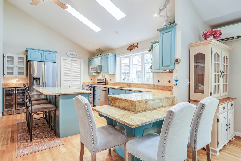 20 Courtney Road Harwich, MA 02645 - Photo 20 of 42 a view of a dining room with furniture and a chandelier
