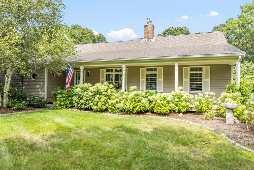 20 Courtney Road Harwich, MA 02645 - Photo 2 of 42 front view of a house with a yard