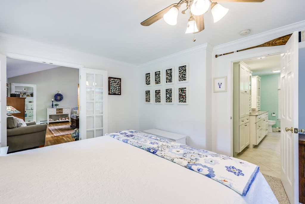 20 Courtney Road Harwich, MA 02645 - Photo 24 of 42 a bedroom with a large bed and dresser