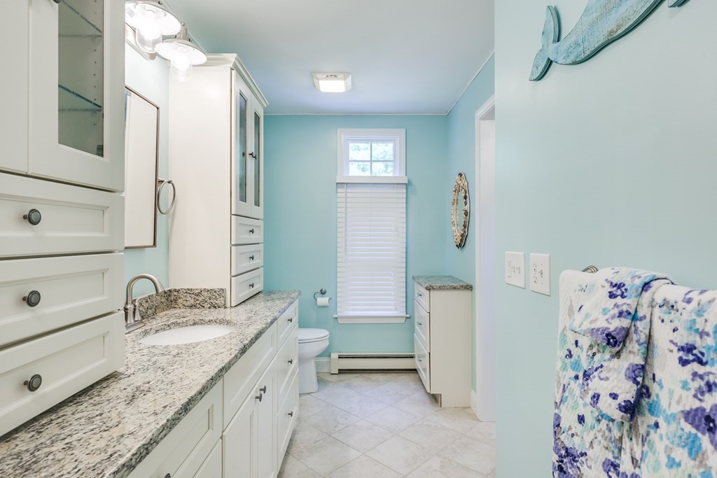 20 Courtney Road Harwich, MA 02645 - Photo 26 of 42 a bathroom with a granite countertop sink and a mirror