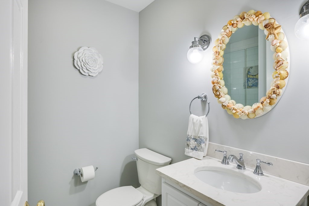 20 Courtney Road Harwich, MA 02645 - Photo 32 of 42 a bathroom with a sink mirror and toilet