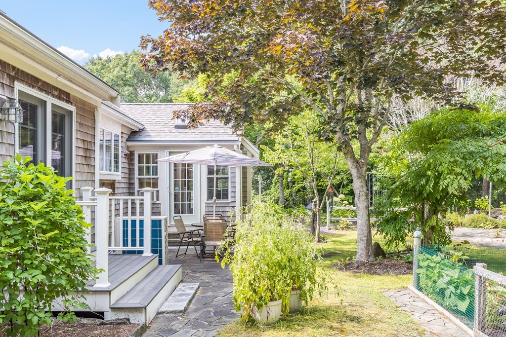 20 Courtney Road Harwich, MA 02645 - Photo 34 of 42 a front view of a house with a yard