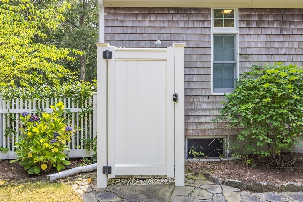 20 Courtney Road Harwich, MA 02645 - Photo 36 of 42 a front view of a house with a garden
