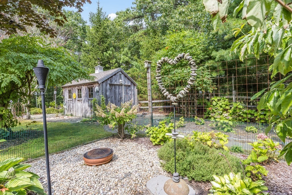 20 Courtney Road Harwich, MA 02645 - Photo 37 of 42 a view of a house with a garden