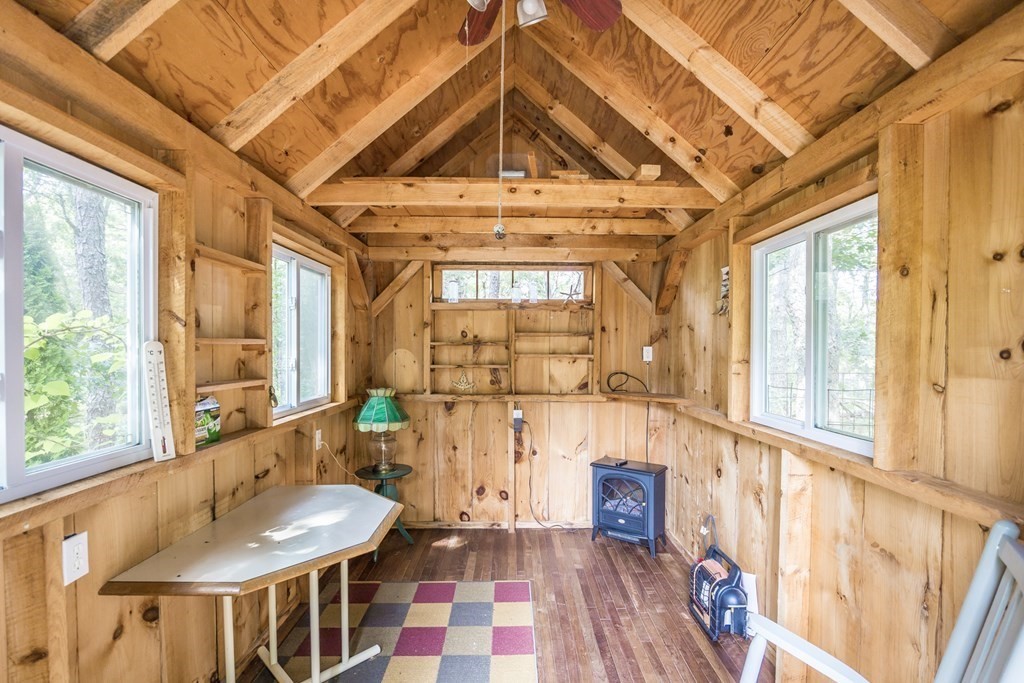 20 Courtney Road Harwich, MA 02645 - Photo 39 of 42 a view of a hallway with wooden floor and a chandelier