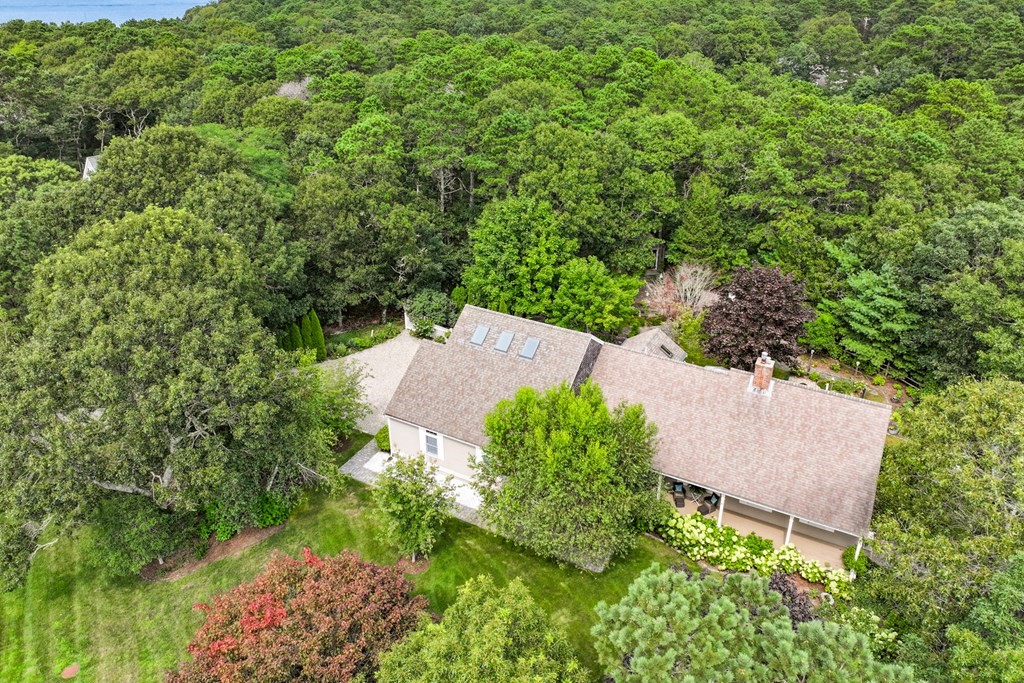 20 Courtney Road Harwich, MA 02645 - Photo 4 of 42 an aerial view of a house with a yard and trees all around