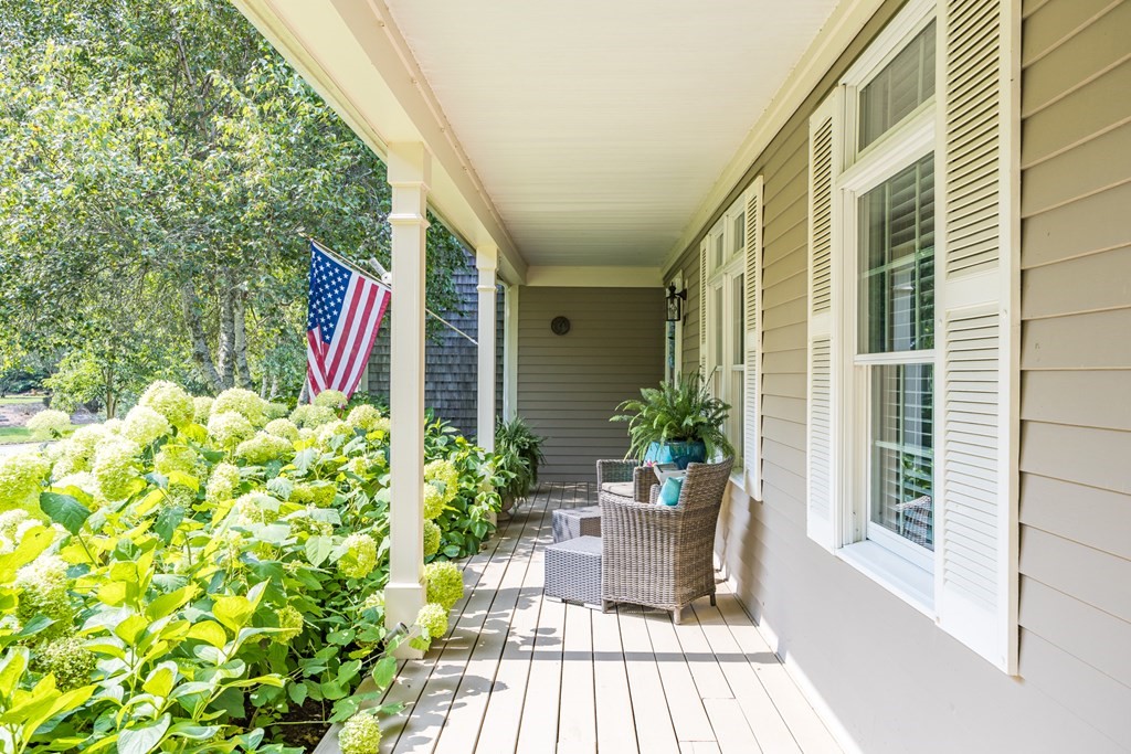 20 Courtney Road Harwich, MA 02645 - Photo 5 of 42 a front view of a house with outdoor seating
