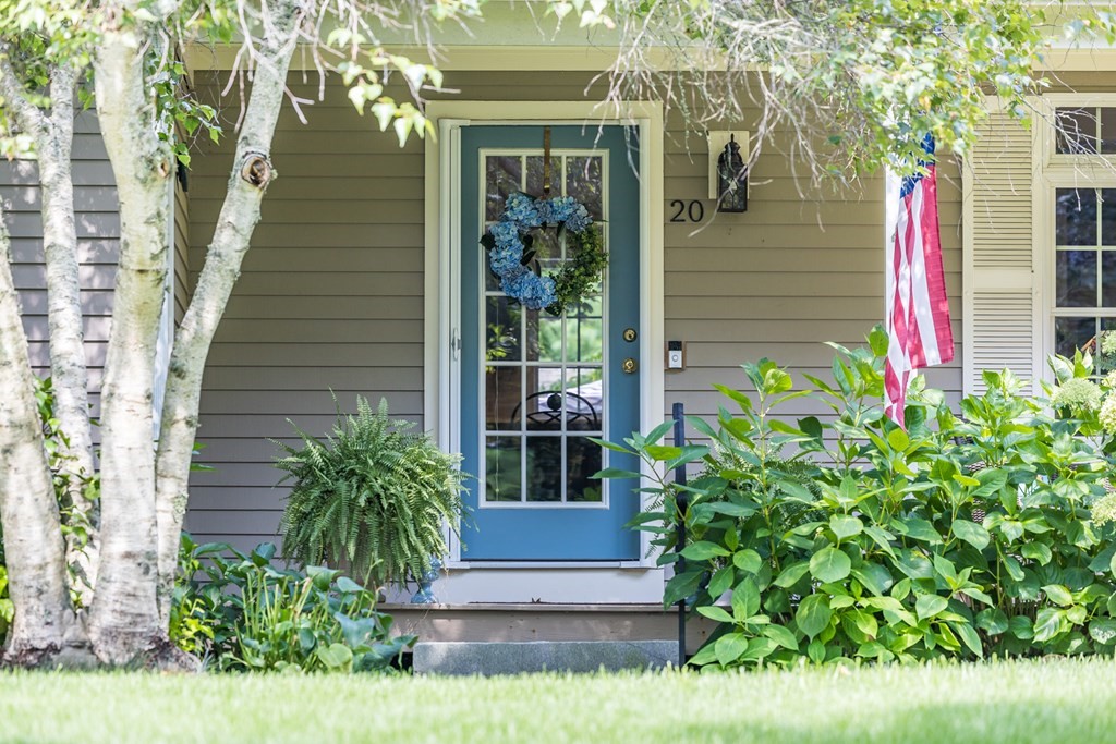 20 Courtney Road Harwich, MA 02645 - Photo 7 of 42 a front view of a house with plants