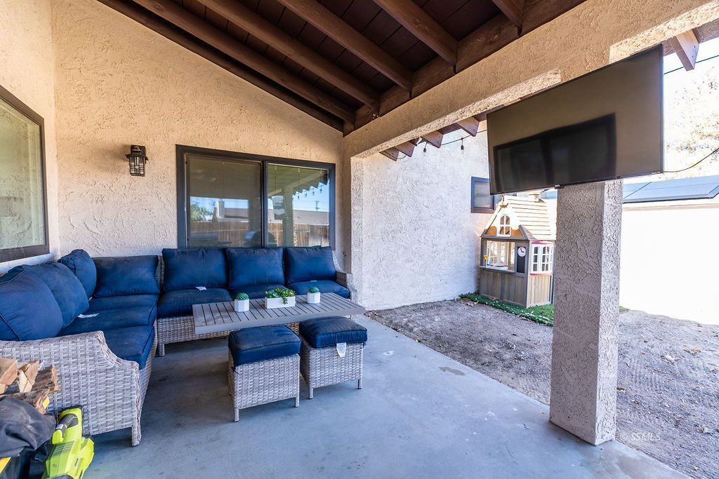538 North Rio Bravo Street Ridgecrest, CA 93555 - Photo 36 of 45 a living room with furniture and a flat screen tv