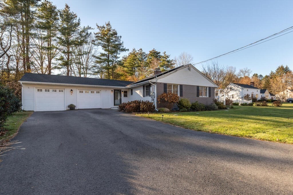 15 Forrest Road Topsfield, MA 01983 - Photo 1 of 26 a view of large white house with a big yard and palm trees