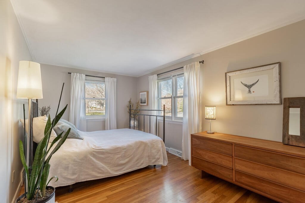 15 Forrest Road Topsfield, MA 01983 - Photo 13 of 26 a bedroom with a bed wooden floor and window