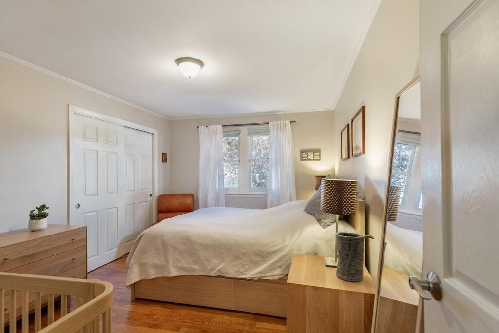 15 Forrest Road Topsfield, MA 01983 - Photo 15 of 26 a bedroom with a bed and wooden floor