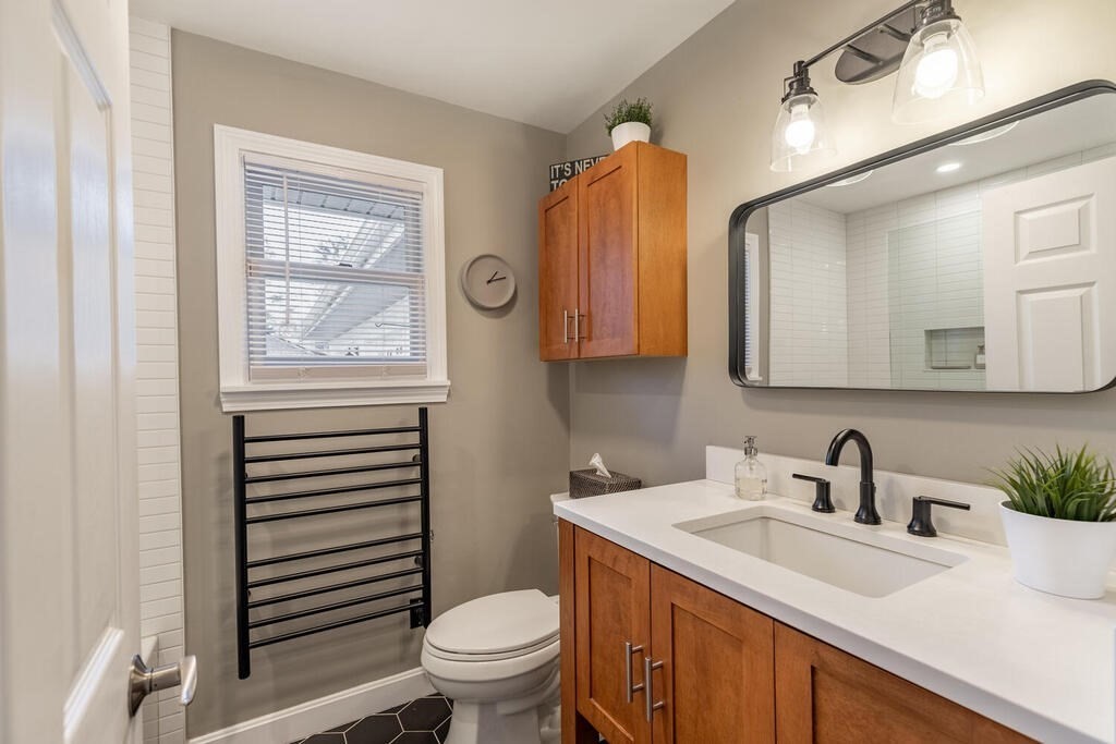 15 Forrest Road Topsfield, MA 01983 - Photo 18 of 26 a bathroom with a sink a toilet and a mirror