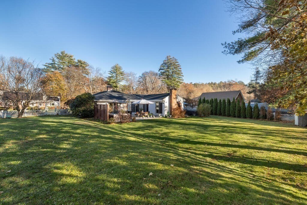 15 Forrest Road Topsfield, MA 01983 - Photo 24 of 26 a front view of a house with a garden