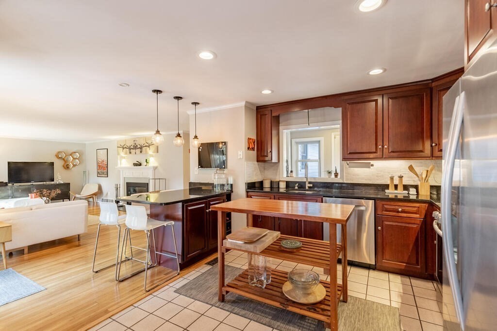 15 Forrest Road Topsfield, MA 01983 - Photo 8 of 26 a large kitchen with lots of counter top space and stainless steel appliances