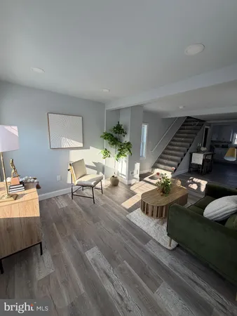 a living room with furniture and a table