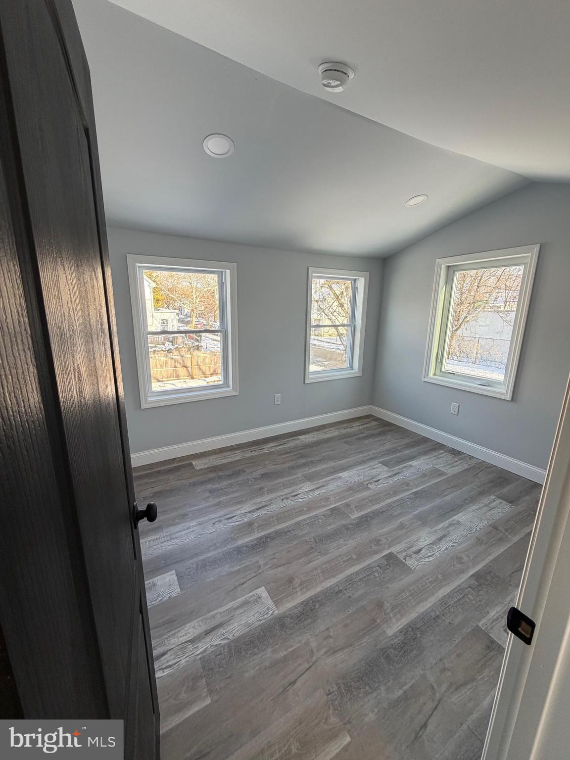 514 Race Street Palmyra, NJ 08065 - Photo 6 of 14 a view of an empty room with wooden floor and a window