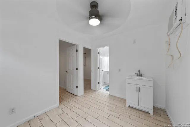 a view of a kitchen from the hallway