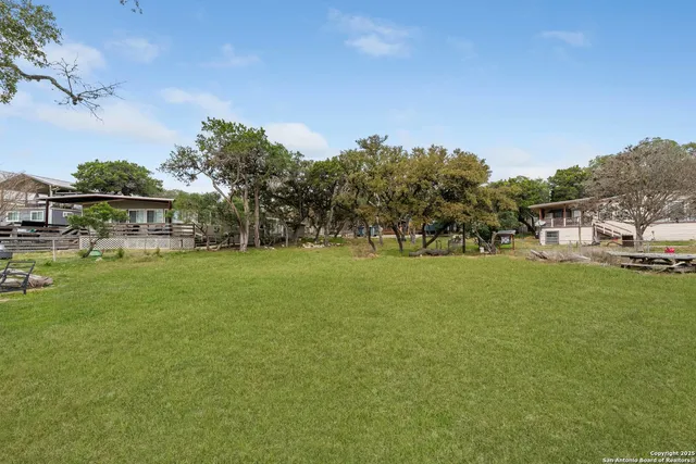 a view of a house with a big yard