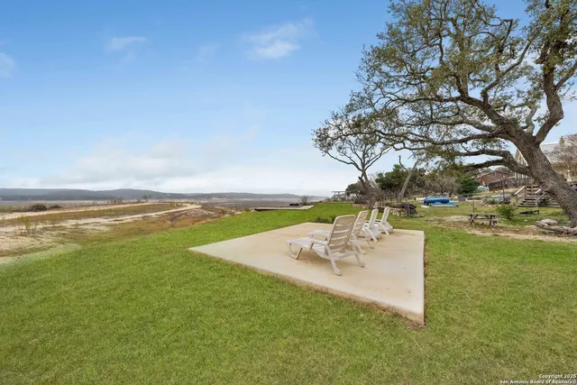 a view of a lake with a yard