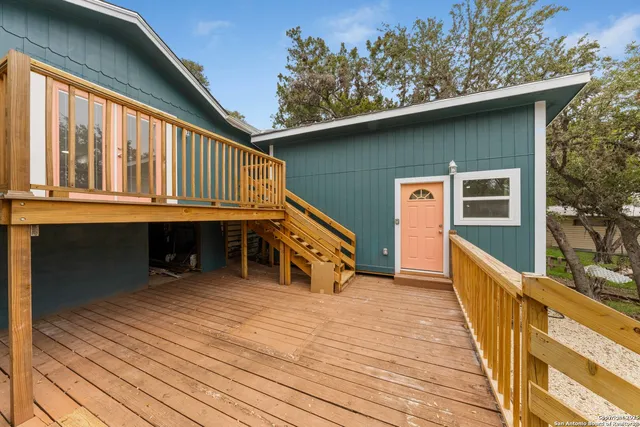 a view of balcony with deck and wooden floor