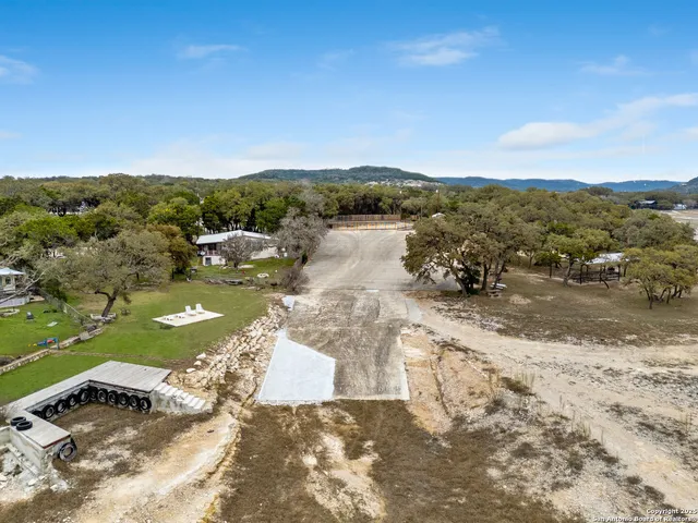 a view of a lake with a yard