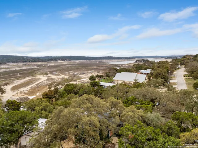 an aerial view of residential building and ocean