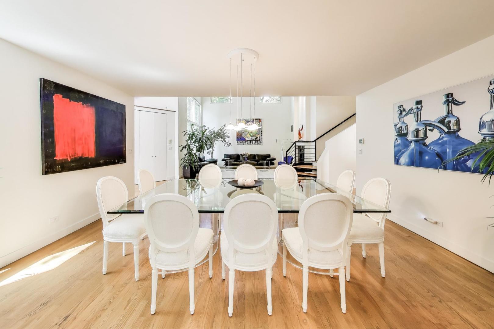 90 Riparian Road Highland Park, IL 60035 - Photo 12 of 76 a view of a dining room with furniture and wooden floor