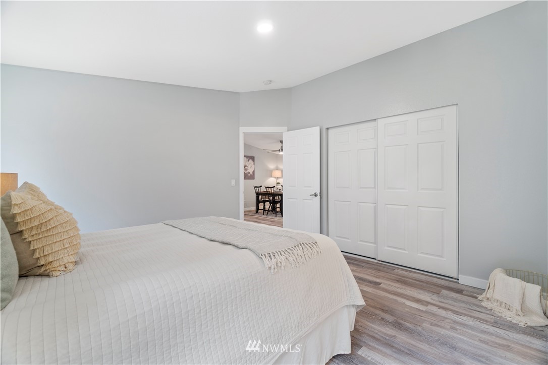259 Sommerville Road Chehalis, WA 98532 - Photo 16 of 25 a bedroom with a bed and a wooden floor