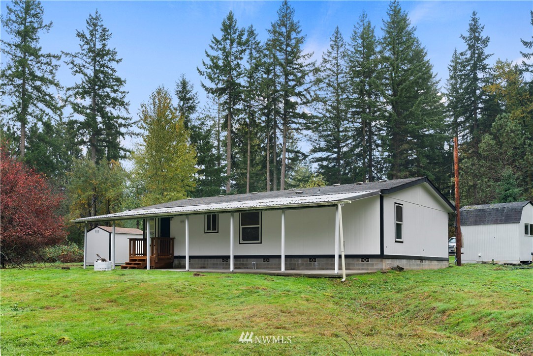 259 Sommerville Road Chehalis, WA 98532 - Photo 22 of 25 a view of a house with a yard and large trees