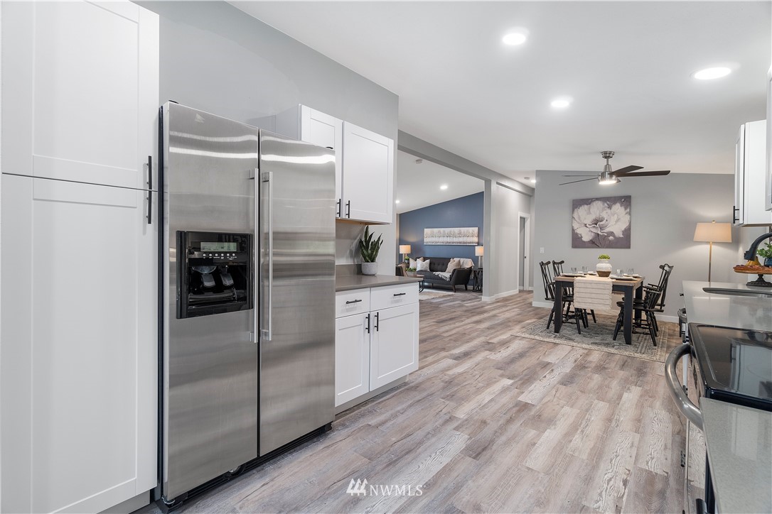 259 Sommerville Road Chehalis, WA 98532 - Photo 8 of 25 a kitchen with a refrigerator and a dining table