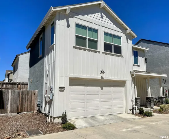 a front view of a house with a garage