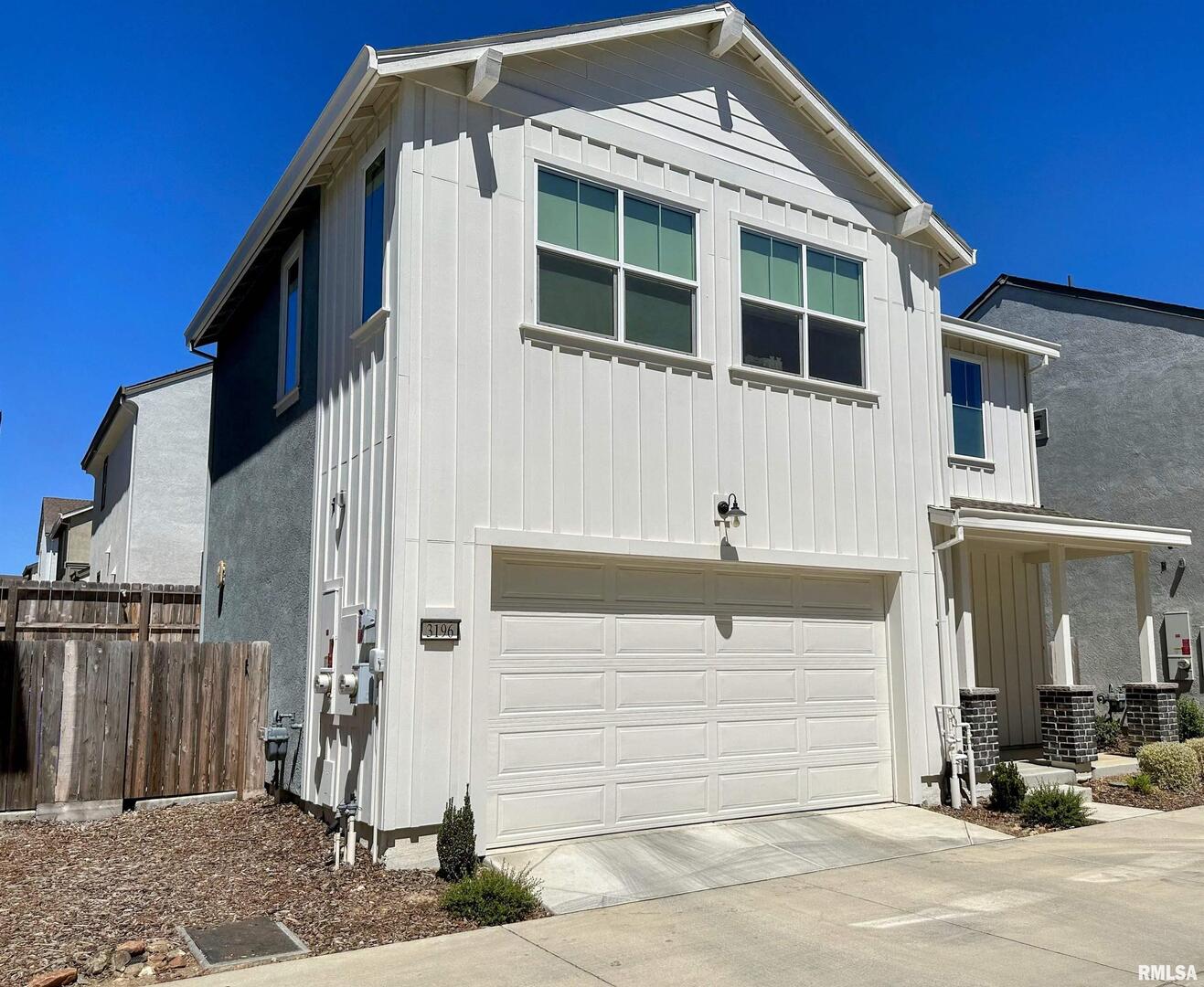 0 Parkside Court Milan, IL 61264 - Photo 2 of 5 a front view of a house with a garage