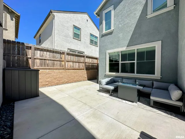a view of a building with furniture