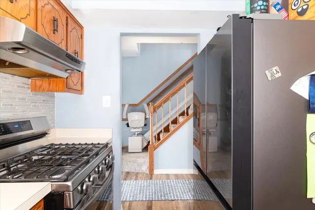 a view of an entryway with wooden floor
