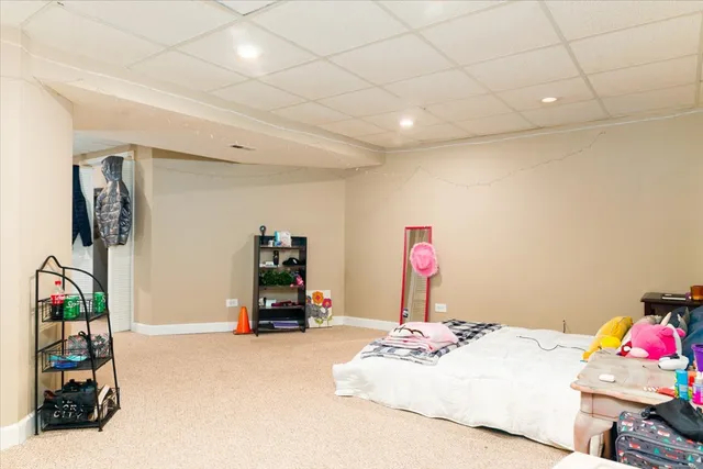 a bedroom with a bed and a tv