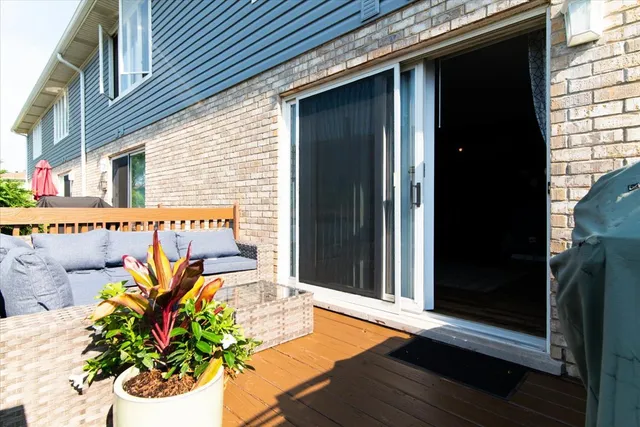 a vase of flowers sitting on a wooden floor